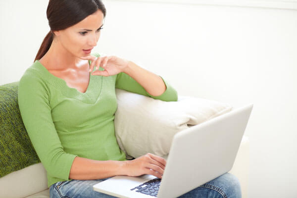 Woman using a laptop.